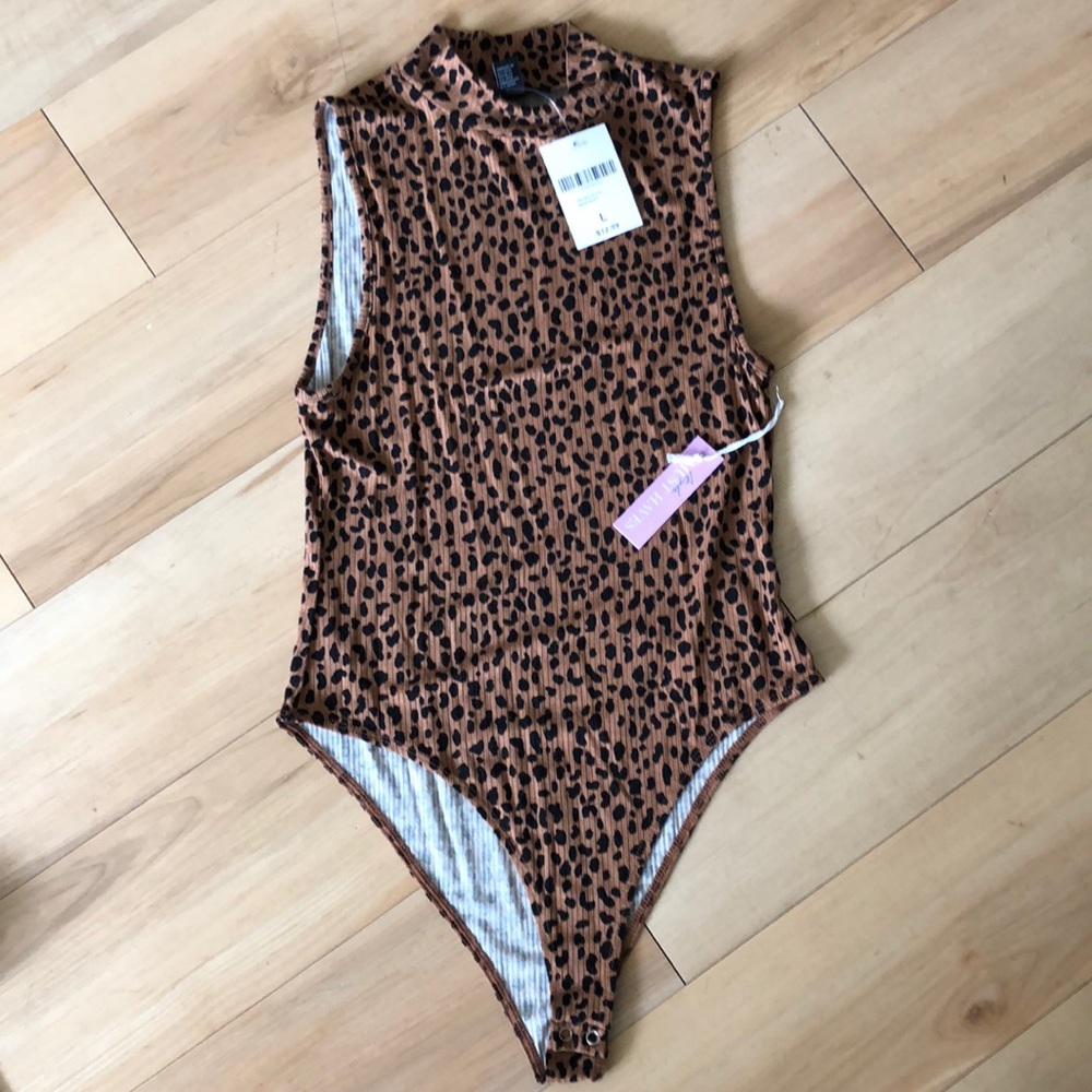 Leopard body suit. New with tags.